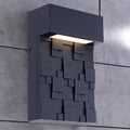 This Exterior Wall Light Features A Striking Modern Design With A Geometric Façade Composed Of Layered Rectangular And Square Patterns. Finished In Matte Black, The Fixture Adds A Bold Architectural Statement To Any Outdoor Space.